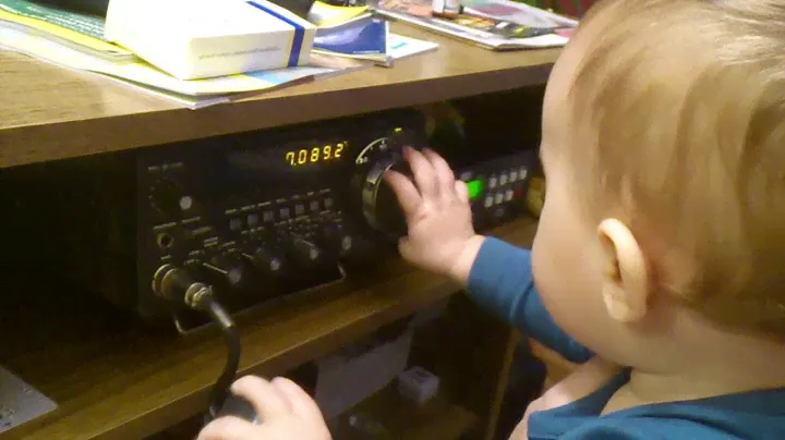 My 11 months old son operating a Yaesu FT-707 HF transceiver :)
